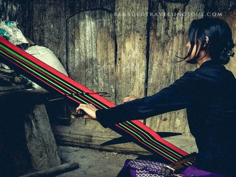 A Naga lady weaving a traditional Angamai woolen Sarong in Viswema Village